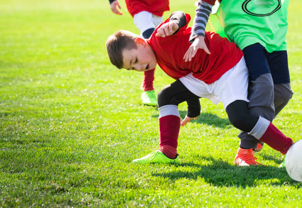 istock Boys play soccer on the field 1213506250