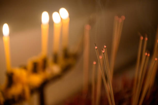 Close up incense sticks burning in temple
