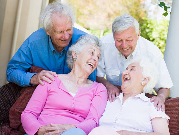istock Group of senior friends laughing 121350647