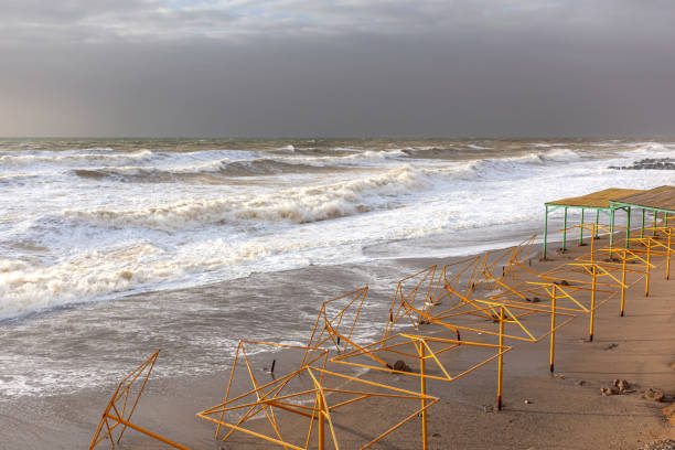 Storm at sea, storm warning on the coast. Thunderclouds and big sea waves during a storm. - image. Storm on the black sea in Crimea
