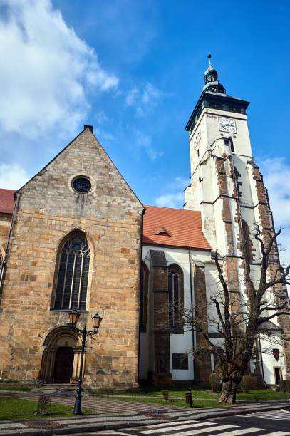 Stone, medieval church with a bell tower and clock in the city of Zlotoryja in Poland