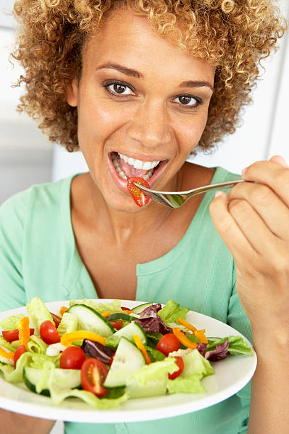 istock Woman Eating A Salad 121350789