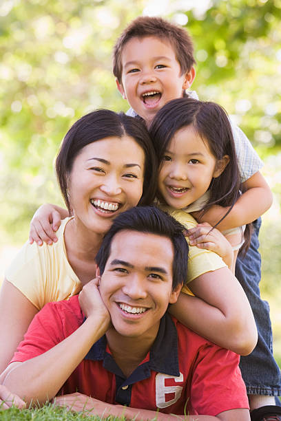 istock Family lying outdoors smiling 121350828