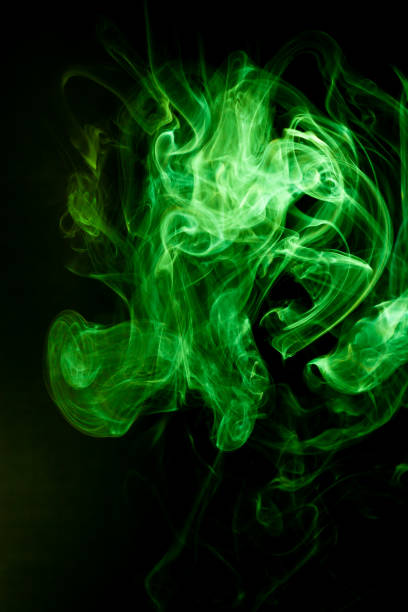istock Green smoke motion on black background. 1213508432