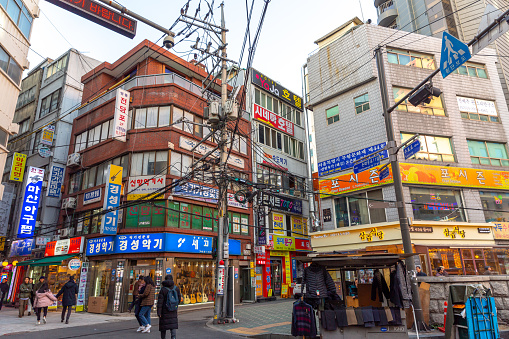This pic shows  Myeong-Dong Neon ares with neon Lights in Seoul, South Korea. The location is the premiere district for shopping in the city. Local people walking in the area for shopping can be seen in the pic with sign board of shops.\nThe pic is taken in november 2019.
