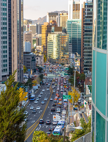 This image shows daily normal street scene of seoul. Cars and traffic with office buildinds can be seen in the image. The image is taken in november  2019 in seoul city of south korea.