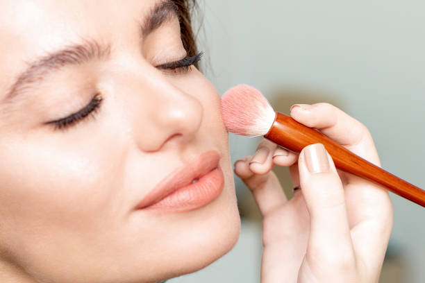 istock Woman receiving makeup. 1213509472