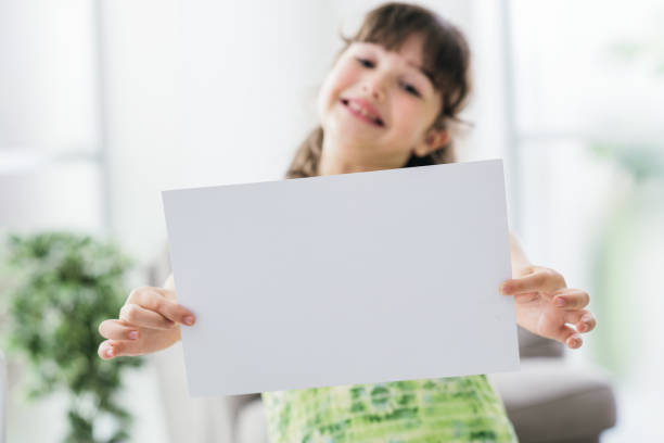 istock Cheerful girl holding a sign 1213509550