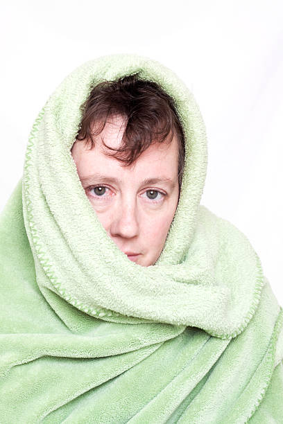 istock Caucasian Woman Wrapped in a Green Blanket 121350970