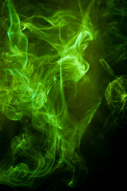 istock Green smoke motion on black background. 1213510080
