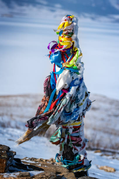 Color shot of shamanic and buddist pray on the Olkhon Island on the Baikal lake, in Russia. View of the sacred and chamanic roc