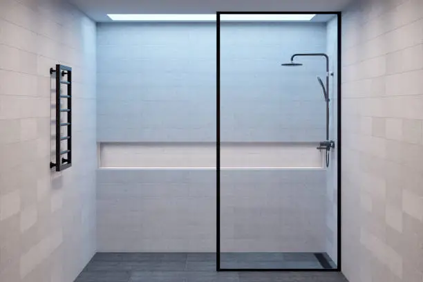 Photo of Empty minimalistic shower room with a window in the ceiling, a niche for bath accessories and a heated towel rail. Front view.