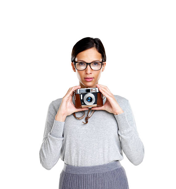istock Young woman holding an old camera 121351375