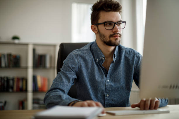 istock Young man working at the office 1213513789