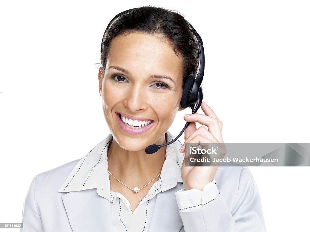 Confiante agente feminino sorridente com fone de ouvido preto - Foto de stock de Fundo Branco royalty-free