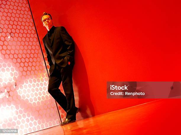 Modern Business Man In A Black Suit And Red Room Stock Photo - Download Image Now - Adult, Backgrounds, Beautiful People