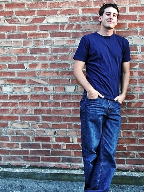 istock Casual Man Standing Against Brick Wall 121352047