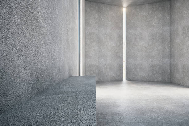 istock Minimalistic concrete room interior with door and bench. 1213521858