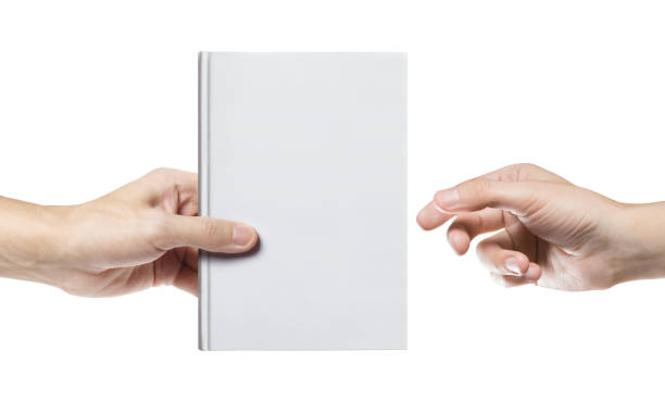istock Hands sharing blank white hard cover book on white 1213522987