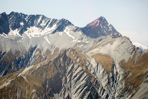 An aerial view of the snow capped Pyrenees mountains on the border of Catalonia, Spain, and France.