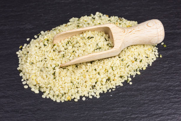 istock hulled hemp seeds with wooden scoop 1213525501
