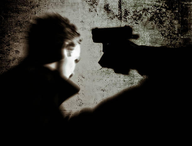 istock Robbery: Person Pointing Gun at a Man 121352656