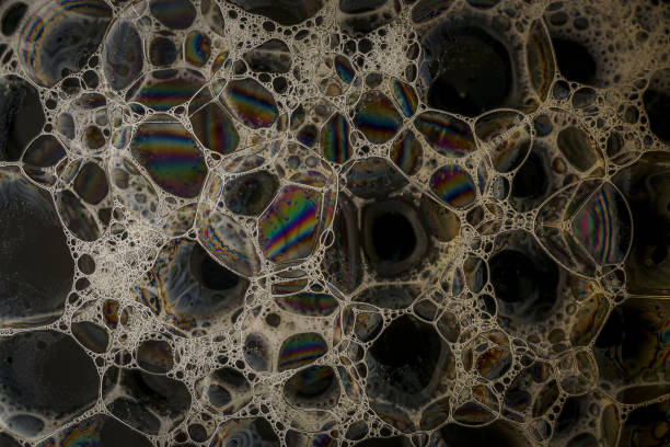 istock Soap bubbles patterns and designs formed by washing up liquid and liquid soaps. 1213526671