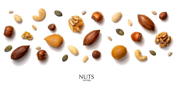 istock Creative layout made of hazelnut nuts, almonds, walnut, peanut, pecan, sunflower seeds. Flat lay with copy space. Fresh food concept. Nuts isolated on white background. 1213529231