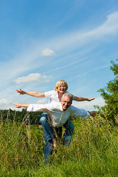 istock Happy senior couple having fun outdoors in summer 121353004