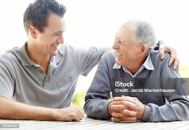 Happy Father And Son Enjoying Themselves Stock Photo - Download Image Now - Senior Adult, Care, Father