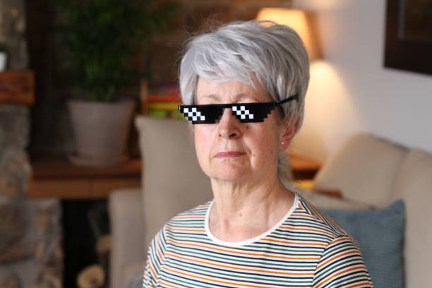 Senior woman wearing pixelated sunglasses Senior woman wearing pixelated sunglasses. meme photos stock pictures, royalty-free photos & images