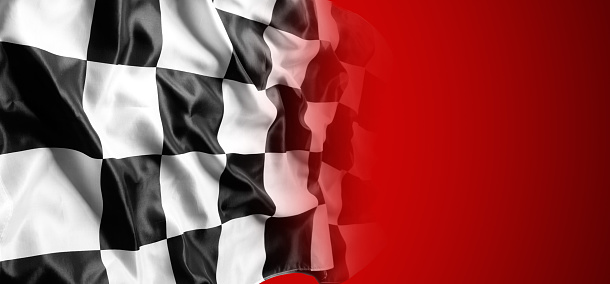 Checkered black and white flag on red background