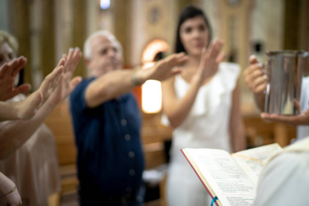 istock People praying at church 1213534875