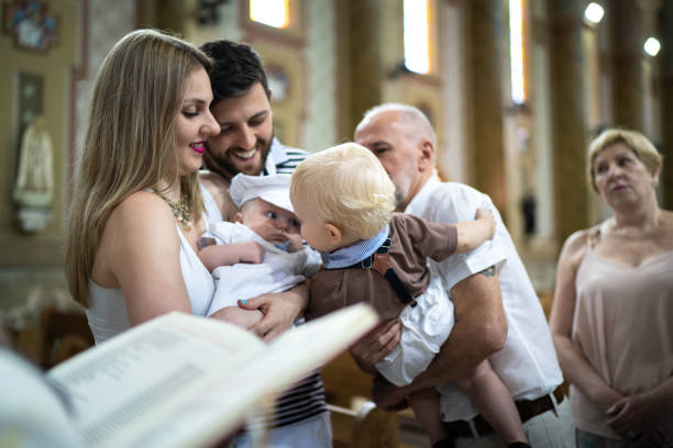 Parents and his son on baptism celebration at church