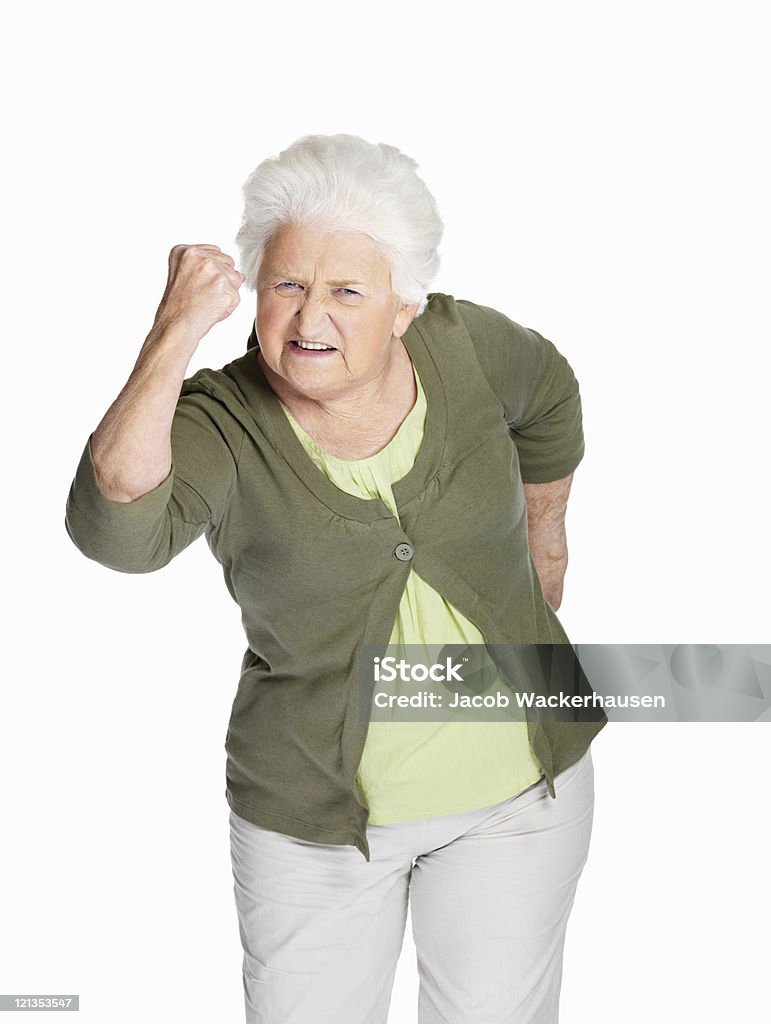Donna anziana scuote il pugno a te - Foto stock royalty-free di Donne anziane