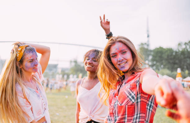 istock Dancing people at summer holi festival 1213540097
