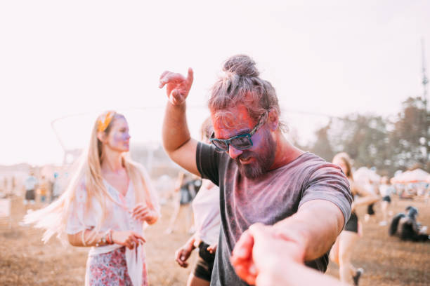 istock Dancing people at summer holi festival 1213540618