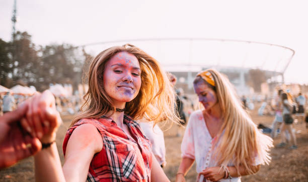 istock Dancing people at summer holi festival 1213540691