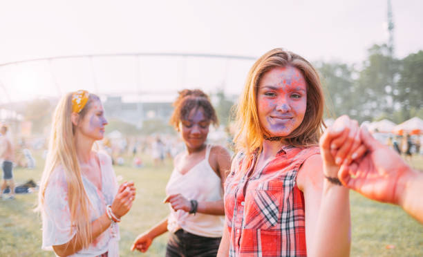 istock Dancing people at summer holi festival 1213540706