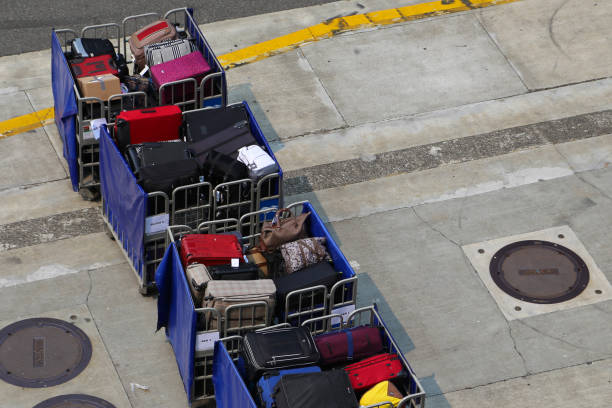istock Luggage outside on a cart to be loaded 1213540744