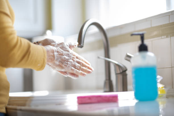 istock Woman Washing Her Hands for Sanitation 1213540754