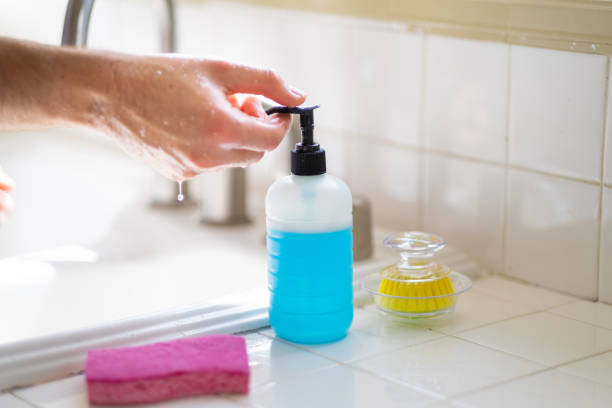 istock Man Washing His Hands at the Kitchen Sink 1213540816