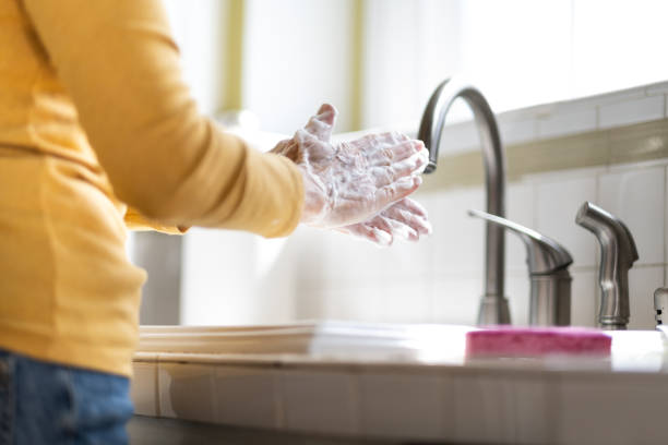 istock Woman Washing Her Hands for Sanitation 1213540891