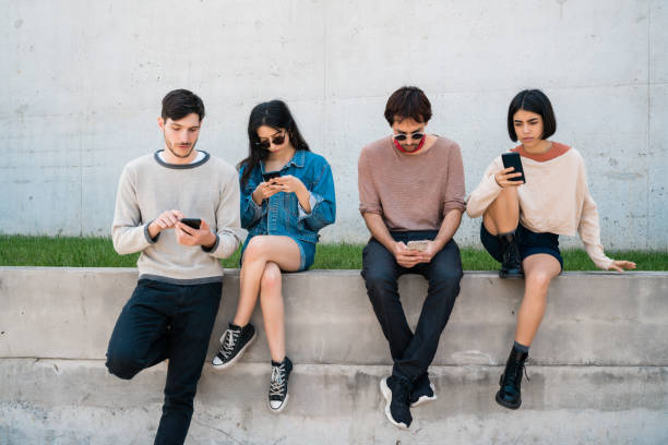 istock Group of friends using their phones. 1213544182