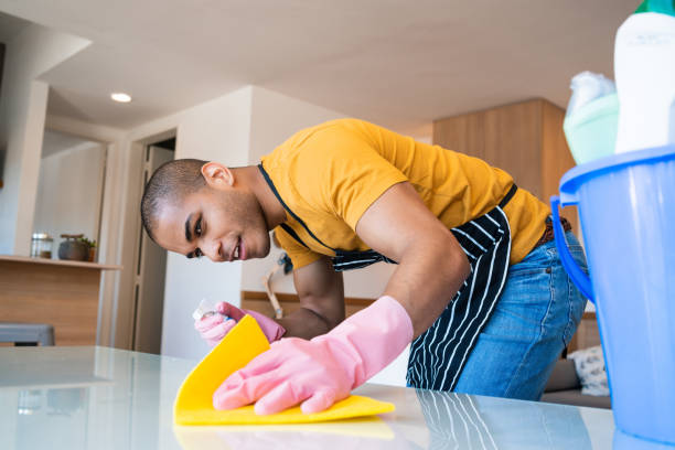 istock Young latin man cleaning at home. 1213544208