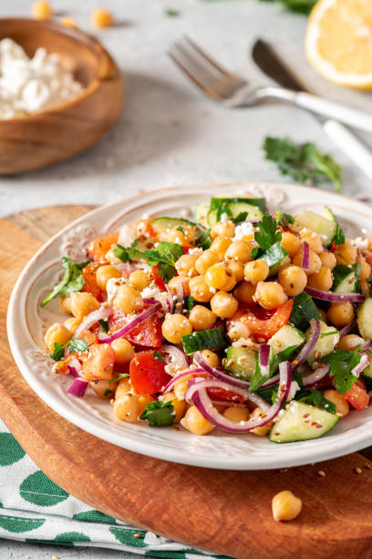 istock Chickpea salad in a plate on a served table 1213545812