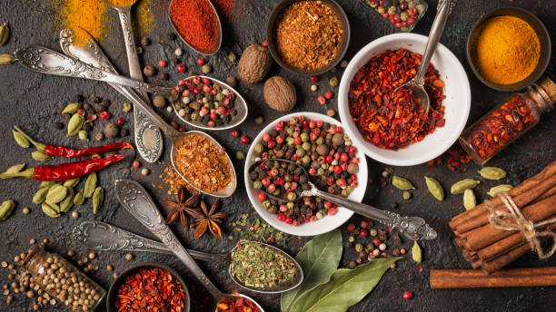 istock Mix bright spices in vintage silver spoons, bowls and vials 1213546090