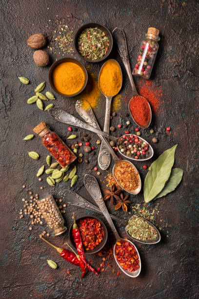 istock Mix bright spices in vintage silver spoons, bowls and vials 1213546093