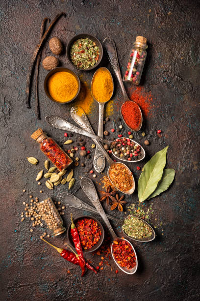 istock Mix bright spices in vintage silver spoons, bowls and vials 1213546102