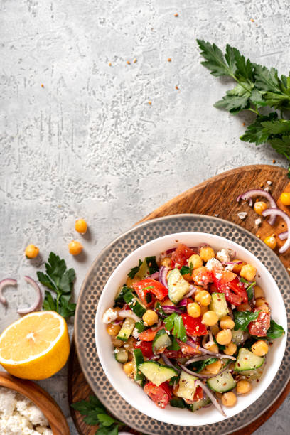 istock Chickpea salad on a gray background top view 1213546167